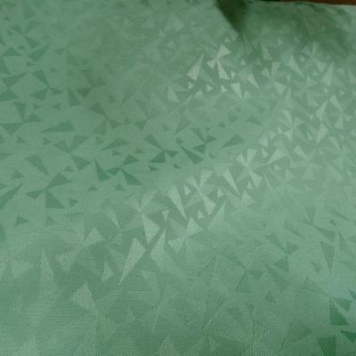 Tissu jacquard vert jade motif geometrique 1 