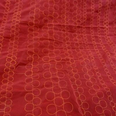 Tissu poly rouge groseille brode fil orange 1 